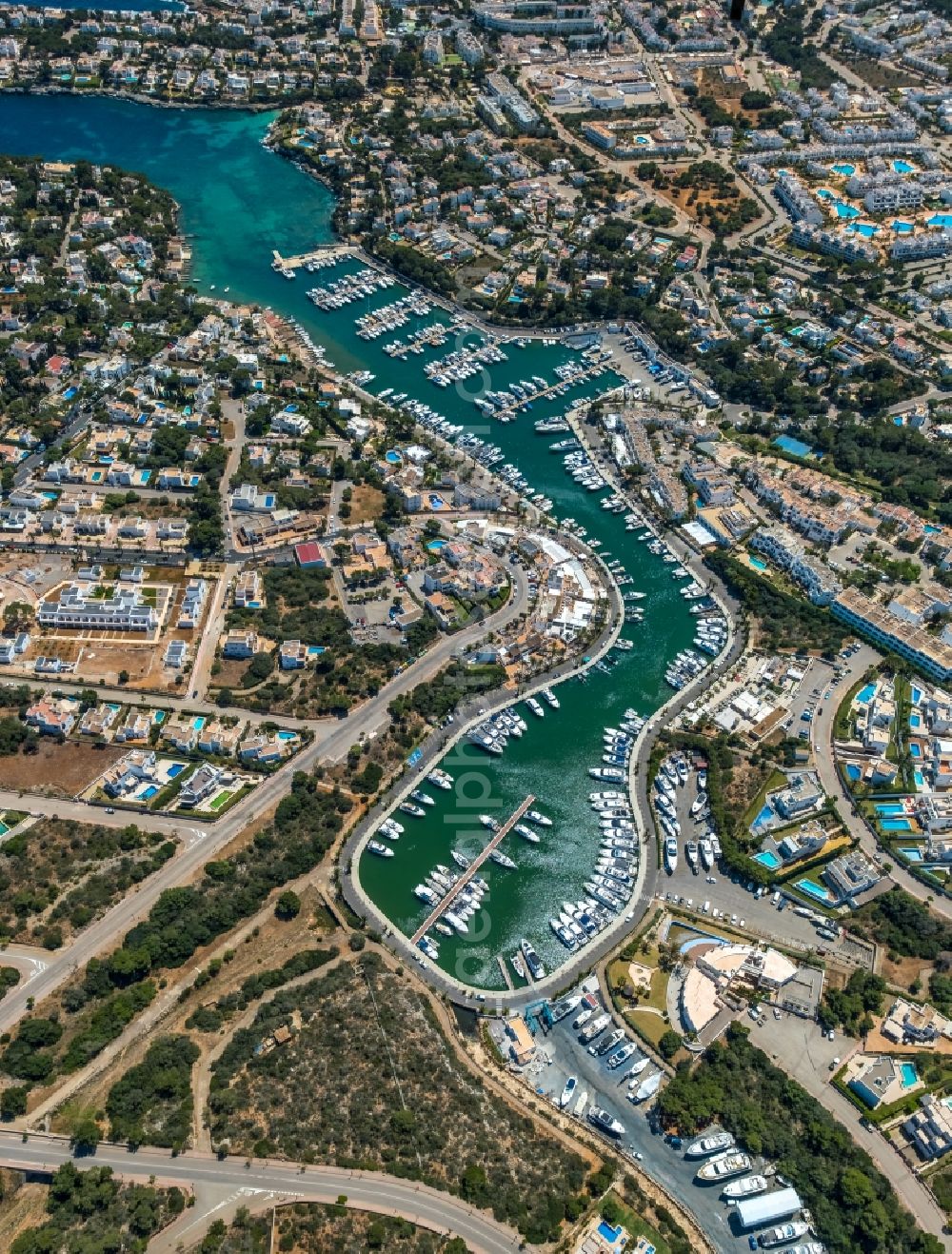 Aerial photograph Santanyi - Pleasure boat marina with docks and moorings on the shore area of the bay Cala Llonga in Santanyi in Balearic island of Mallorca, Spain