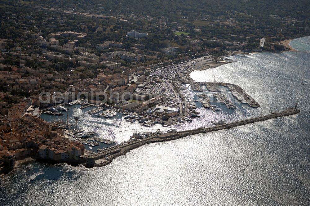 Saint-Tropez from above - Pleasure boat marina with docks and moorings on the shore area Golfe de Saint-Tropez in Saint-Tropez in Provence-Alpes-Cote d'Azur, France