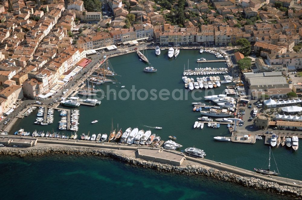 Aerial image Saint-Tropez - Pleasure boat marina with docks and moorings on the shore area Golfe de Saint-Tropez in Saint-Tropez in Provence-Alpes-Cote d'Azur, France