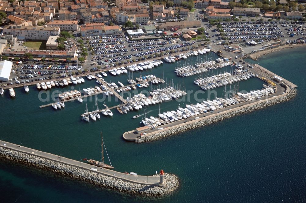 Saint-Tropez from above - Pleasure boat marina with docks and moorings on the shore area Golfe de Saint-Tropez in Saint-Tropez in Provence-Alpes-Cote d'Azur, France