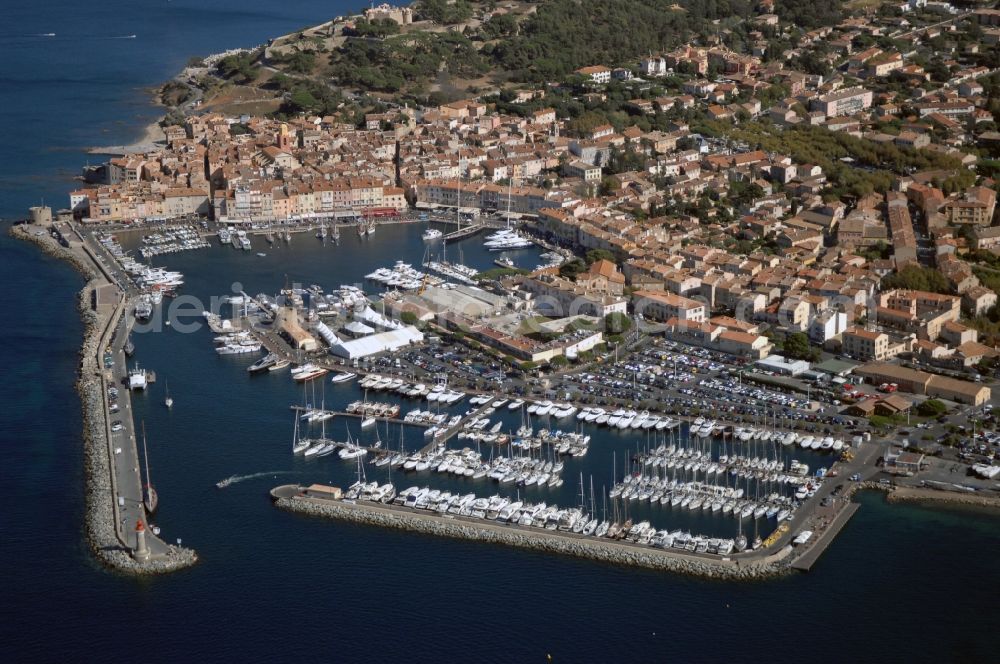 Aerial image Saint-Tropez - Pleasure boat marina with docks and moorings on the shore area Golfe de Saint-Tropez in Saint-Tropez in Provence-Alpes-Cote d'Azur, France