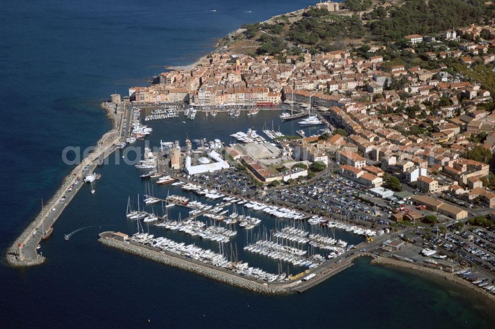 Saint-Tropez from above - Pleasure boat marina with docks and moorings on the shore area Golfe de Saint-Tropez in Saint-Tropez in Provence-Alpes-Cote d'Azur, France