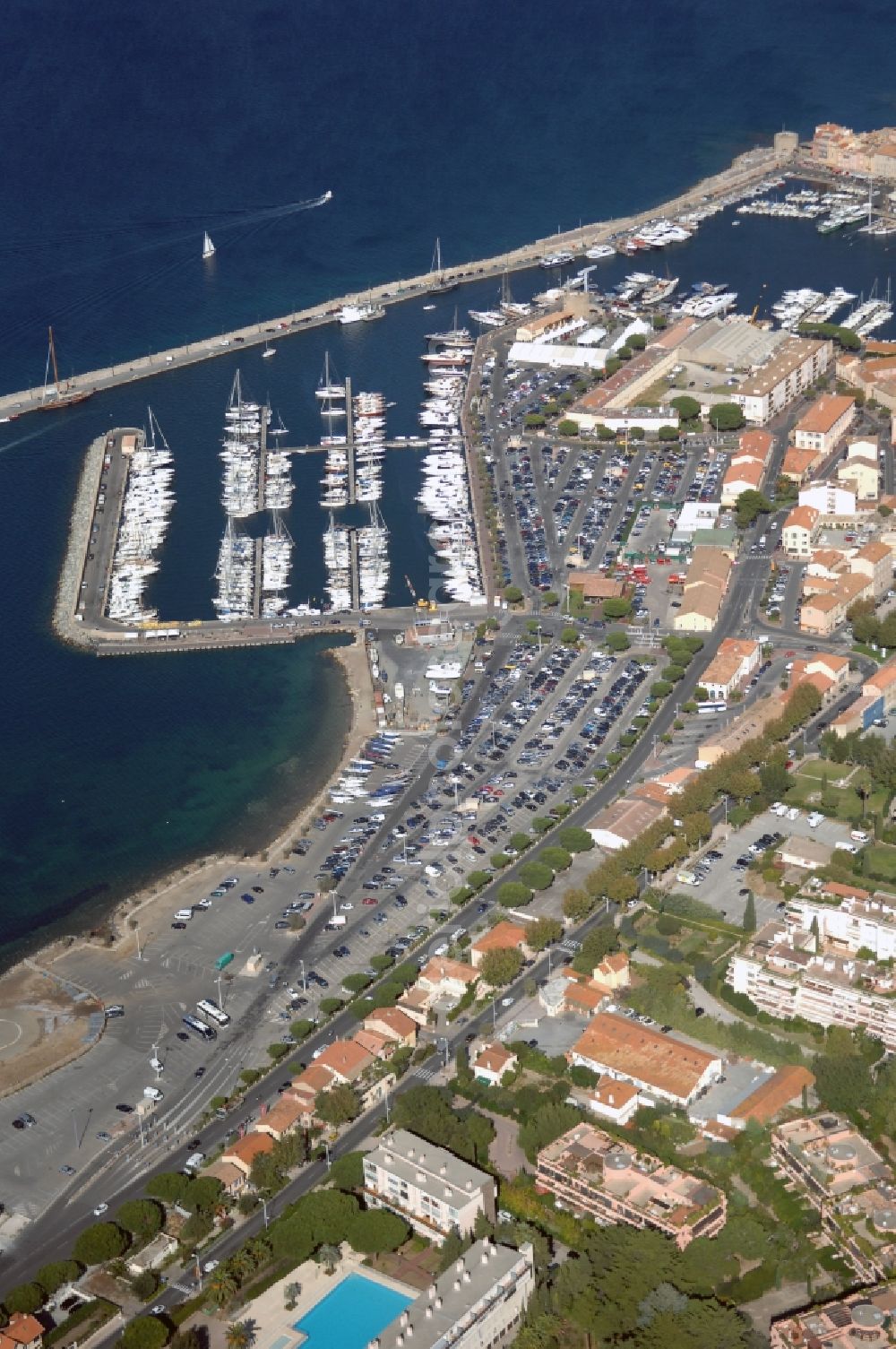 Saint-Tropez from above - Pleasure boat marina with docks and moorings on the shore area Golfe de Saint-Tropez in Saint-Tropez in Provence-Alpes-Cote d'Azur, France