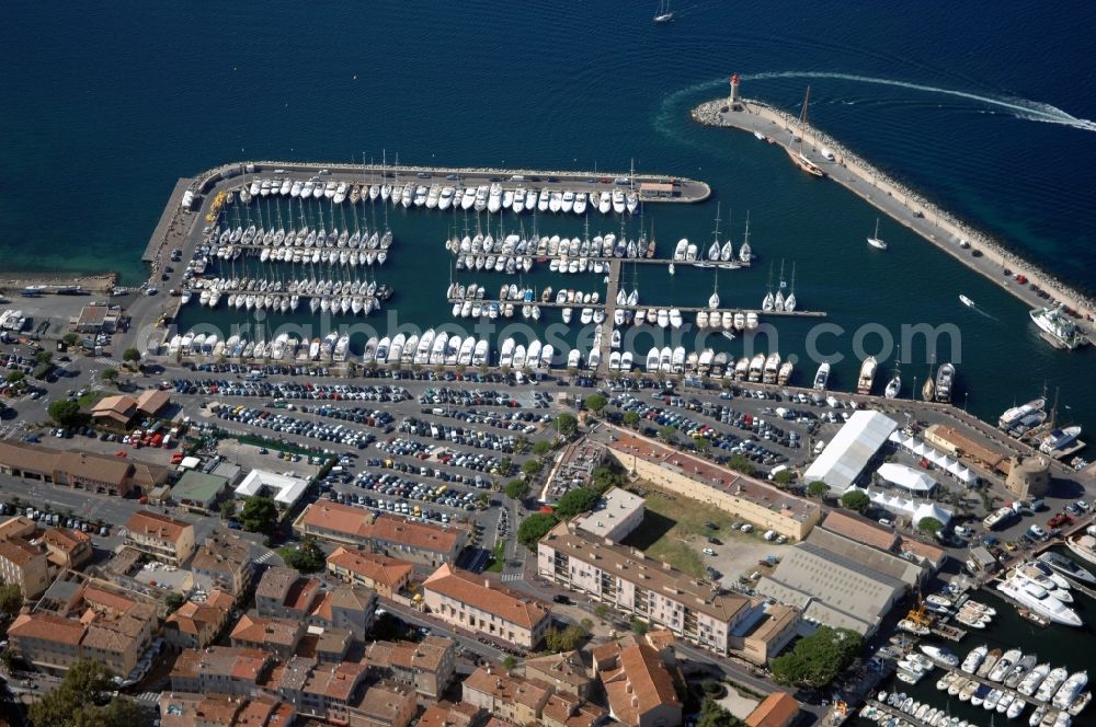 Saint-Tropez from above - Pleasure boat marina with docks and moorings on the shore area Golfe de Saint-Tropez in Saint-Tropez in Provence-Alpes-Cote d'Azur, France