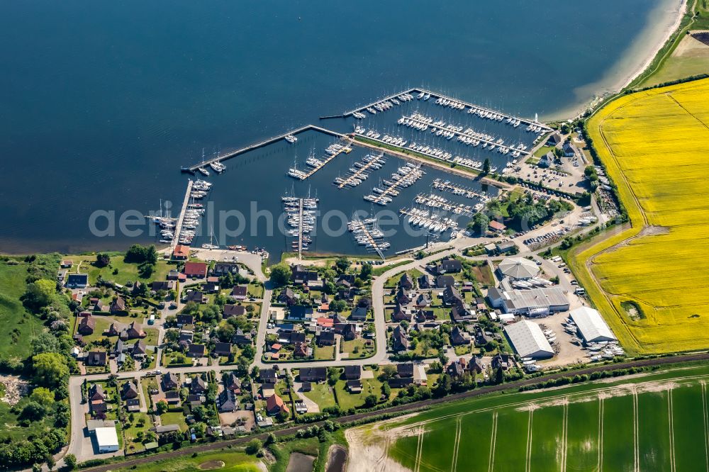 Aerial image Großenbrode - Pleasure boat marina with docks and moorings on the shore area of Grossenbroder Binnensee in Grossenbrode in the state Schleswig-Holstein, Germany