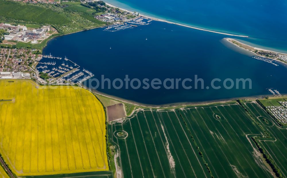 Großenbrode from above - Pleasure boat marina with docks and moorings on the shore area Grossenbroder Binnensee in Grossenbrode in the state Schleswig-Holstein, Germany