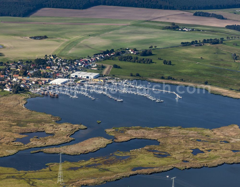 Kröslin from the bird's eye view: Pleasure boat marina with docks and moorings on the shore area of BALTIC SEA RESORT of Kroessliner See on street Hafenstrasse in Kroeslin in the state Mecklenburg - Western Pomerania, Germany