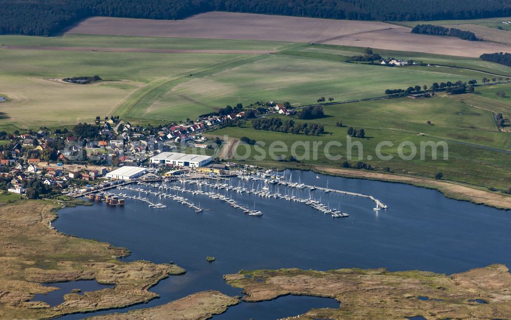 Aerial image Kröslin - Pleasure boat marina with docks and moorings on the shore area of BALTIC SEA RESORT of Kroessliner See on street Hafenstrasse in Kroeslin in the state Mecklenburg - Western Pomerania, Germany