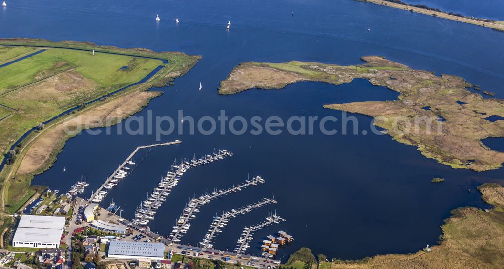 Aerial image Kröslin - Pleasure boat marina with docks and moorings on the shore area of BALTIC SEA RESORT of Kroessliner See on street Hafenstrasse in Kroeslin in the state Mecklenburg - Western Pomerania, Germany