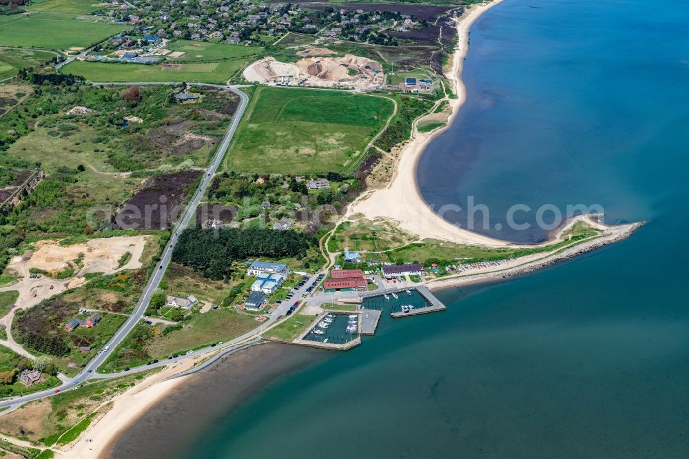 Munkmarsch from above - Pleasure boat marina with docks and moorings on the shore area northern sea in Munkmarsch at the island Sylt in the state Schleswig-Holstein, Germany