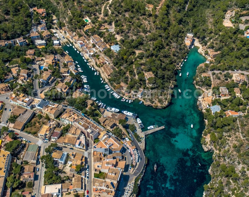 Cala Figuera from above - Pleasure boat marina with docks and moorings on the shore area of the Port de Cala Figuera and Calo d'en Busques in Cala Figuera in Balearic island of Mallorca, Spain