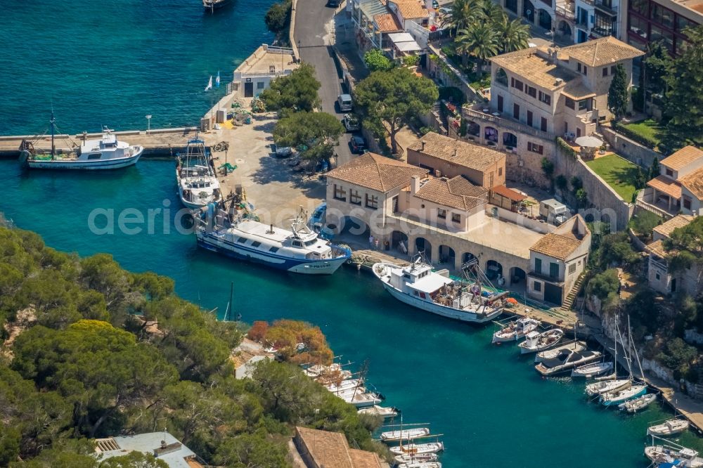 Cala Figuera from the bird's eye view: Pleasure boat marina with docks and moorings on the shore area of the Port de Cala Figuera and Calo d'en Busques in Cala Figuera in Balearic island of Mallorca, Spain