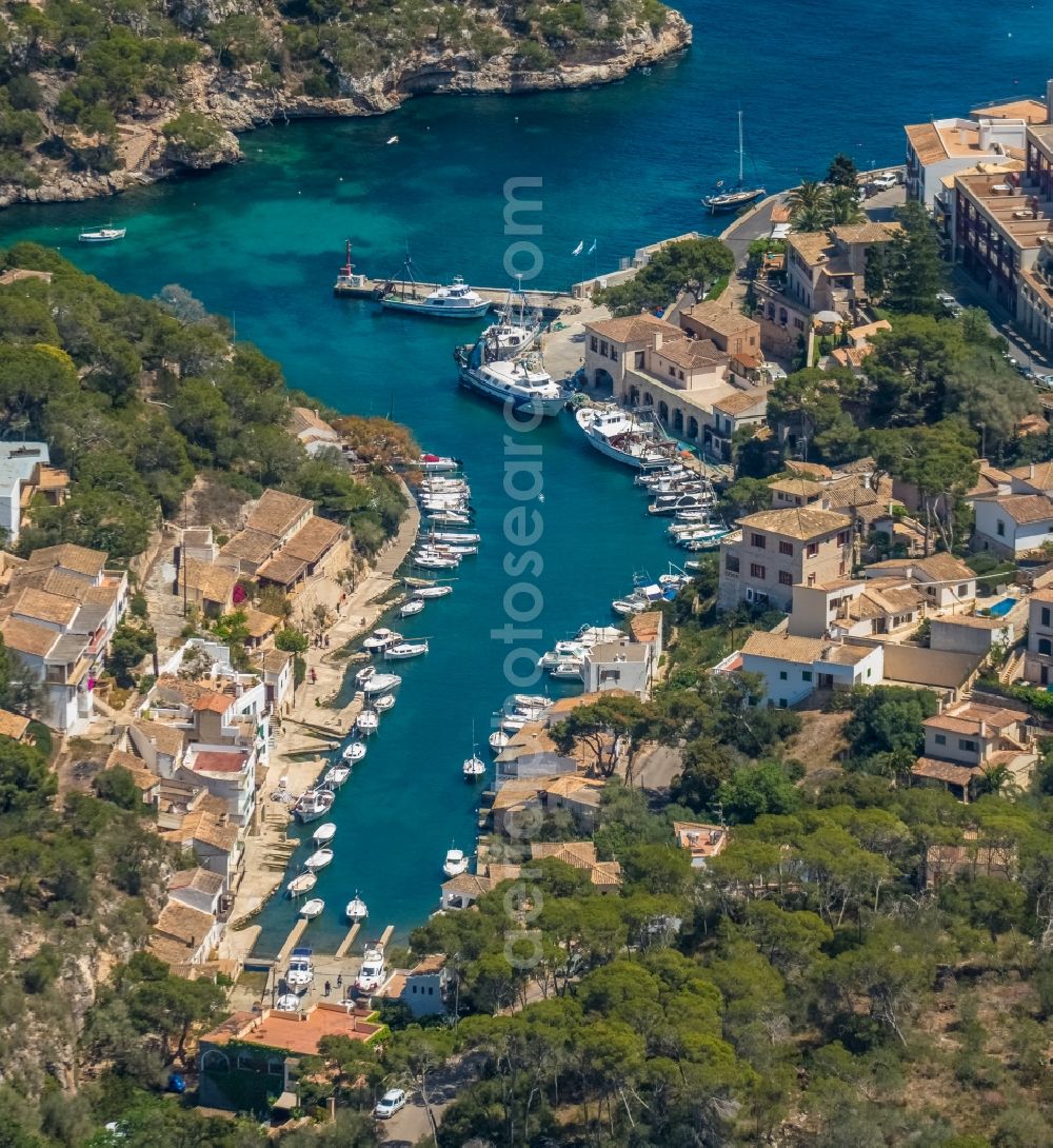 Cala Figuera from above - Pleasure boat marina with docks and moorings on the shore area of the Port de Cala Figuera and Calo d'en Busques in Cala Figuera in Balearic island of Mallorca, Spain