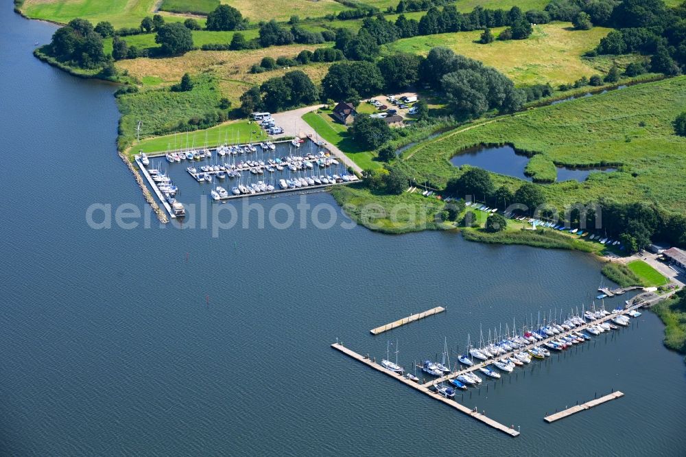 Fleckeby from the bird's eye view: Pleasure boat marina with docks and moorings on the shore area of Schlei in Fleckeby in the state Schleswig-Holstein, Germany