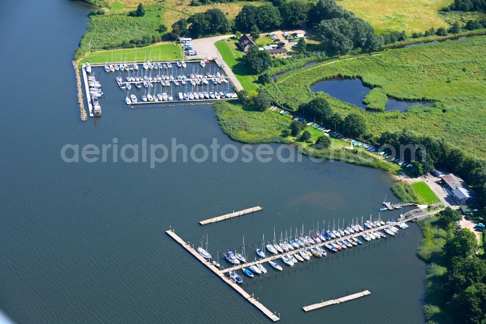 Aerial photograph Fleckeby - Pleasure boat marina with docks and moorings on the shore area of Schlei in Fleckeby in the state Schleswig-Holstein, Germany