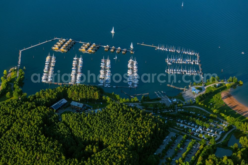 Pleinfeld from the bird's eye view: Pleasure boat marina with docks and moorings on the shore area Segelhafen Ramsberg and Floating Village on lake Grosser Brombachsee in Pleinfeld in the state Bavaria, Germany