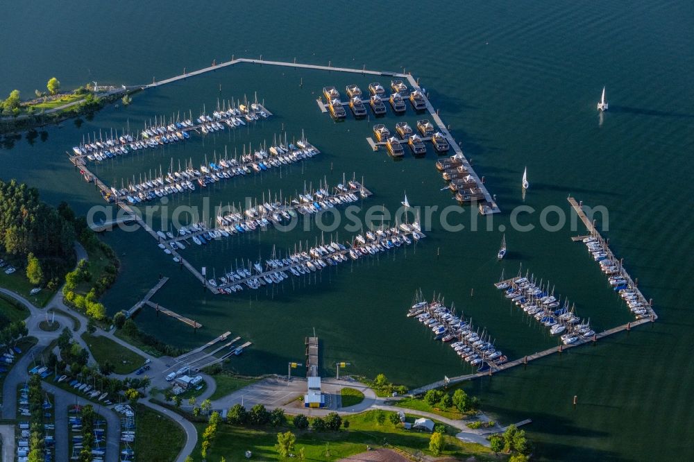 Pleinfeld from above - Pleasure boat marina with docks and moorings on the shore area Segelhafen Ramsberg and Floating Village on lake Grosser Brombachsee in Pleinfeld in the state Bavaria, Germany