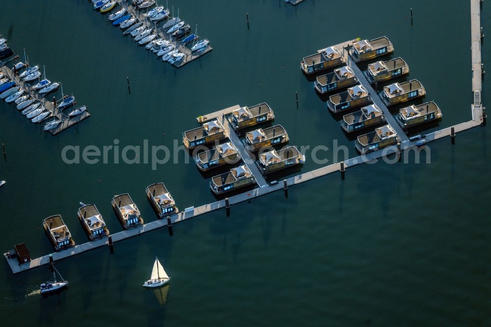 Pleinfeld from the bird's eye view: Pleasure boat marina with docks and moorings on the shore area Segelhafen Ramsberg and Floating Village on lake Grosser Brombachsee in Pleinfeld in the state Bavaria, Germany