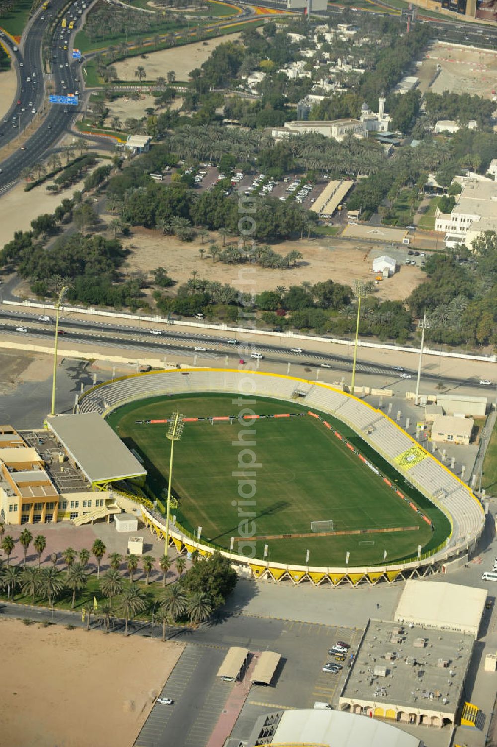 Dubai from the bird's eye view: Blick auf das Zabeel Stadium nahe der Oud Metha Road in Dubai. Die Anlage gehört zum Al Wasl Sports Club in Dubai. Es ist ein Mehrzweckstadion, das allerdings überwiegend für Fußßballspiele genutzt wird. Es wurde 1974 gebaut und hat eine Kapazität von 18,000 Personen. View of the Zabeel Stadium in Dubai. The stadium and its complex belongs to the Al Wasl Sports Club. It is a multi-purpose stadium but is mostly used for football matches. The stadium was built in 1974 and holds 18,000 people.