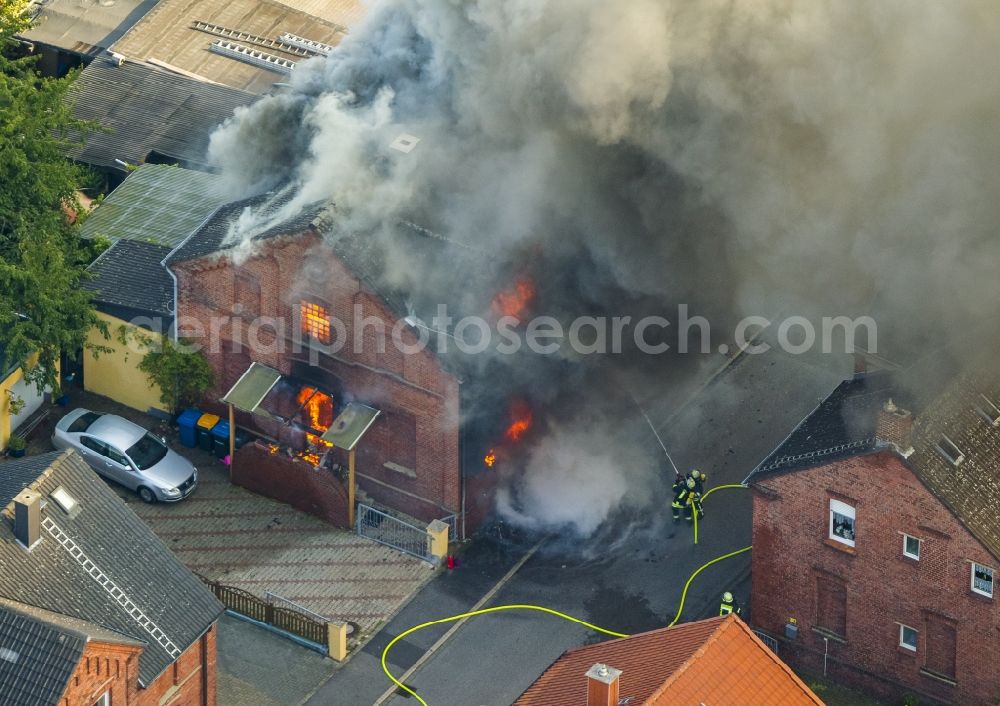 Aerial photograph Bönen - Large Fire - Brandherd- house fire in the Gustav Street in Boenen in the Ruhr area in North Rhine-Westphalia