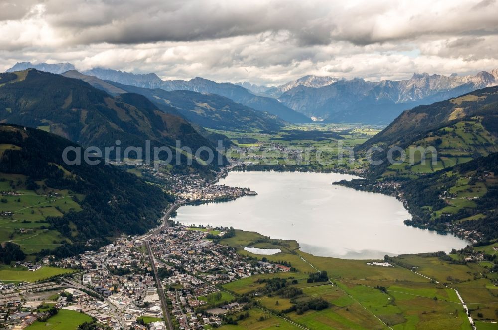 Aerial image Zell am See - View of Lake Zell in a valley in the alps in the state Salzburg in Austria. On the lake the city Zell am See is located, which follows the course of the railway line and the Seespitzstrasse along the lake