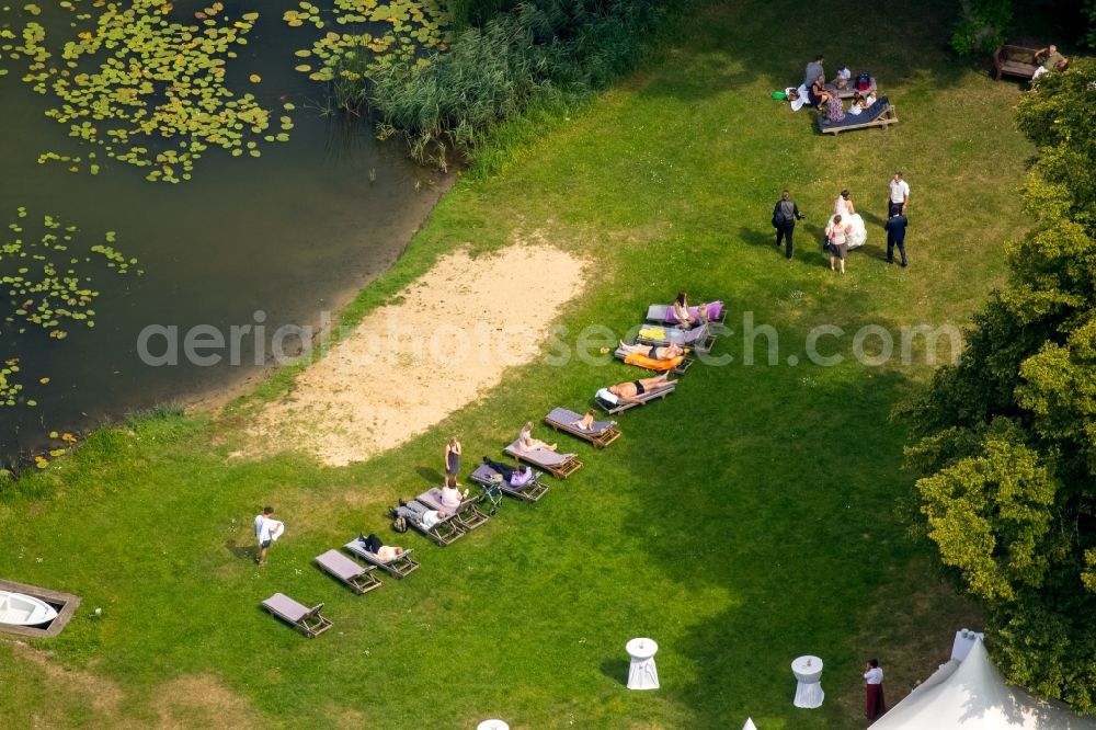 Aerial photograph Schwinkendorf - Tent construction at the venue of a Wedding at the bank of the Ulrichshuser lake in the district Ulrichshusen in Schwinkendorf in the state Mecklenburg - Western Pomerania