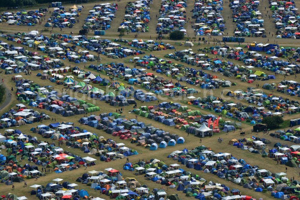 Gräfenhainichen from the bird's eye view: View of campground landscape for visitors to the Melt! Festival in Eisenstadt Ferropolis in Graefenhainichen in the state of Saxony-Anhalt. The Melt is a music festival with electronic music and Rock Sound. Since 1999 the festival at Graefenhainichen takes place in the City of Steel Ferropolis