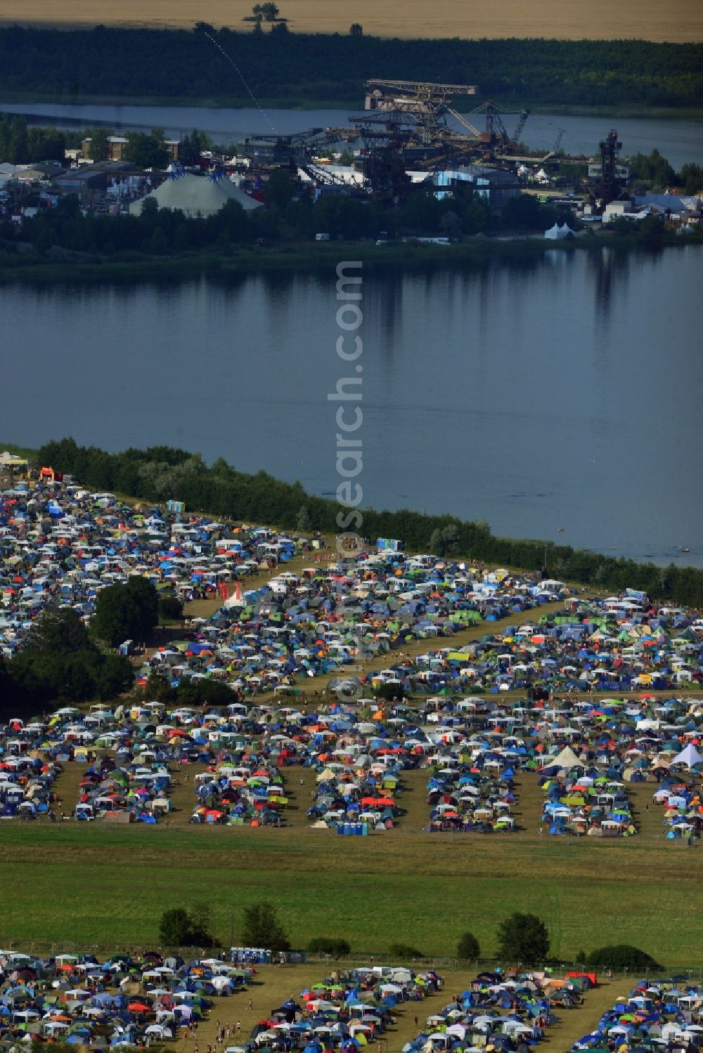 Gräfenhainichen from above - View of campground landscape for visitors to the Melt! Festival in Eisenstadt Ferropolis in Graefenhainichen in the state of Saxony-Anhalt. The Melt is a music festival with electronic music and Rock Sound. Since 1999 the festival at Graefenhainichen takes place in the City of Steel Ferropolis