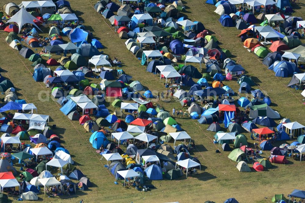 Gräfenhainichen from above - View of campground landscape for visitors to the Melt! Festival in Eisenstadt Ferropolis in Graefenhainichen in the state of Saxony-Anhalt. The Melt is a music festival with electronic music and Rock Sound. Since 1999 the festival at Graefenhainichen takes place in the City of Steel Ferropolis