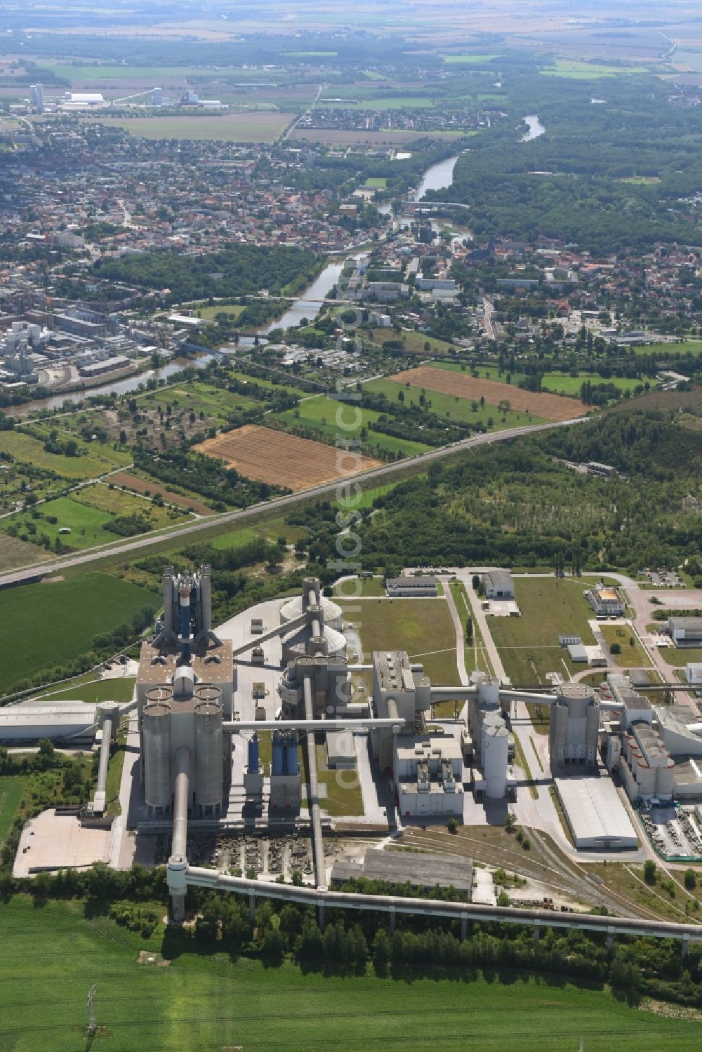 Bernburg (Saale) from the bird's eye view: Site and Terrain of overburden surfaces Cement opencast mining Schwenk in Bernburg (Saale) in the state Saxony-Anhalt, Germany