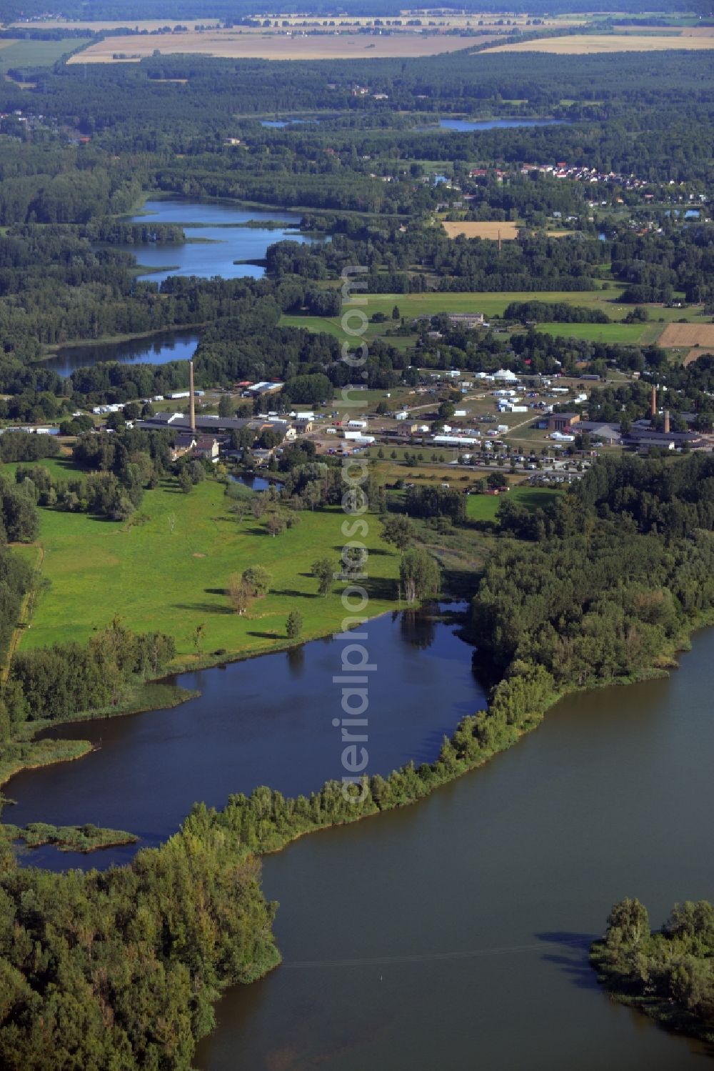 Aerial photograph Zehdenick - Mildenberg brick work park in the town area of Zehdenick in the state of Brandenburg. The park is an industrial memorial, surrounded by lakes and ponds. The compound consists of the company sites of two former brick works and is located in the North of the Mildenberg part of the town