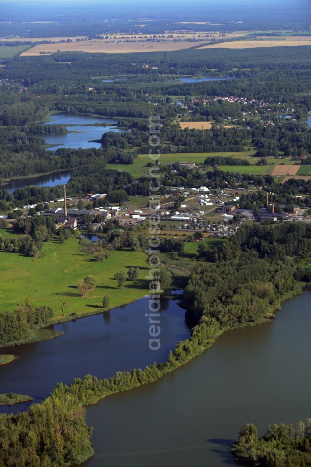 Zehdenick from above - Mildenberg brick work park in the town area of Zehdenick in the state of Brandenburg. The park is an industrial memorial, surrounded by lakes and ponds. The compound consists of the company sites of two former brick works and is located in the North of the Mildenberg part of the town