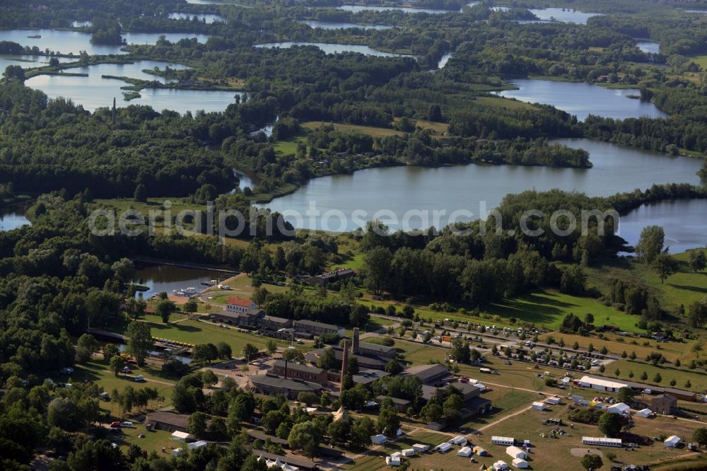 Aerial photograph Zehdenick - Mildenberg brick work park in the town area of Zehdenick in the state of Brandenburg. The park is an industrial memorial, surrounded by lakes and ponds. The compound consists of the company sites of two former brick works and is located in the North of the Mildenberg part of the town