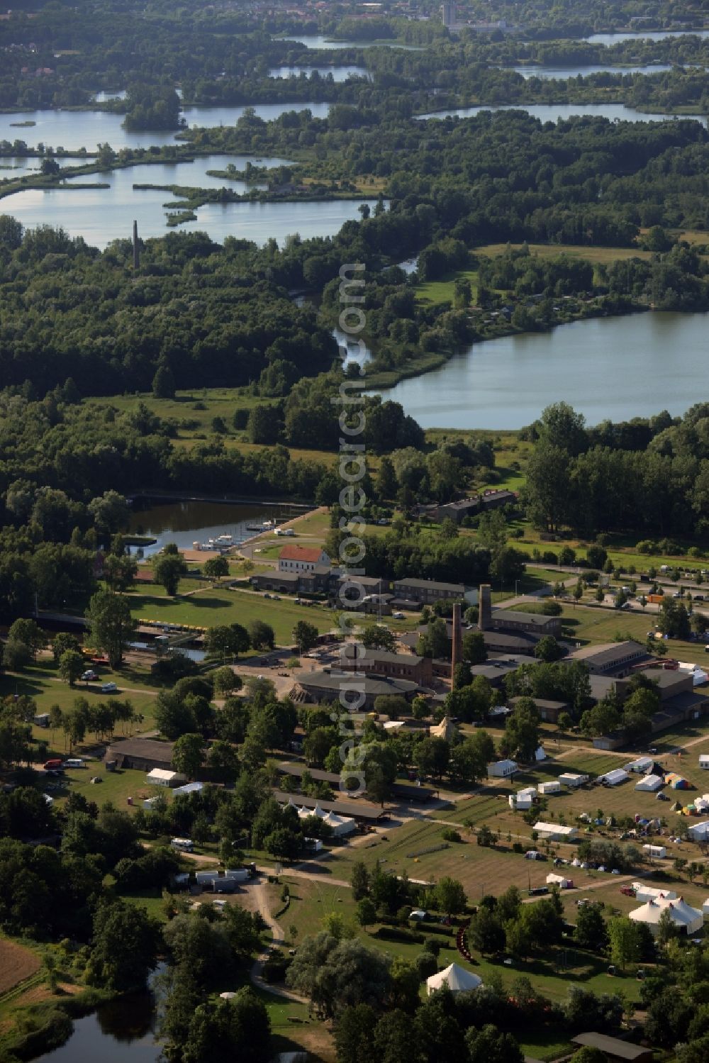 Aerial photograph Zehdenick - Mildenberg brick work park in the town area of Zehdenick in the state of Brandenburg. The park is an industrial memorial, surrounded by lakes and ponds. The compound consists of the company sites of two former brick works and is located in the North of the Mildenberg part of the town