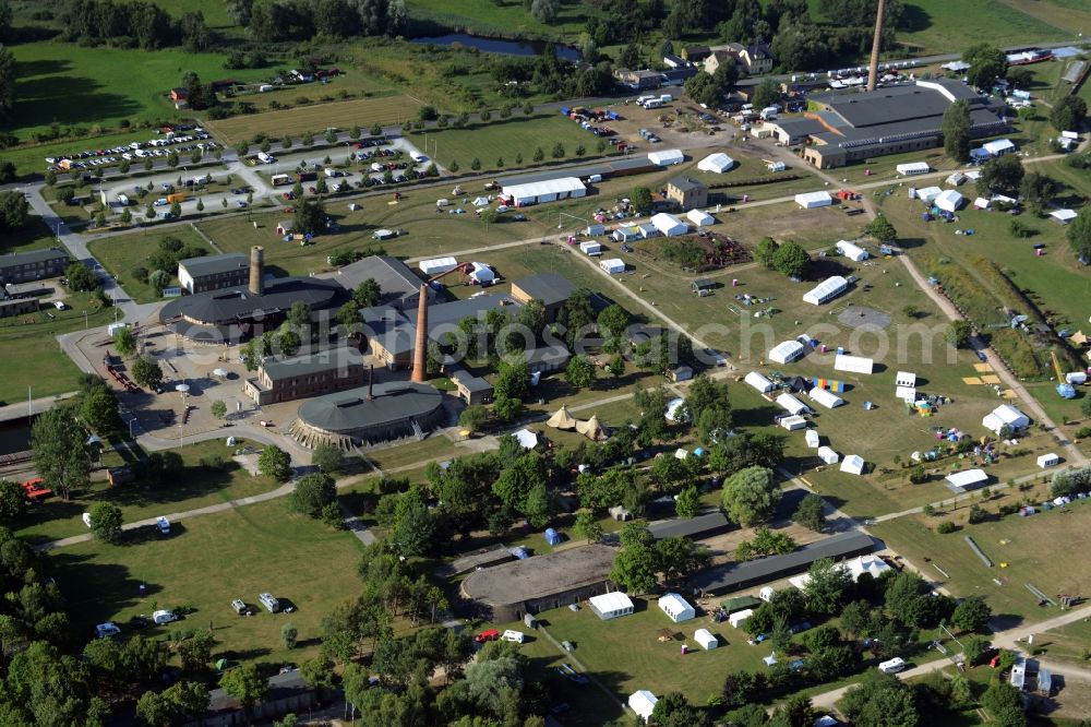 Zehdenick from above - Mildenberg brick work park in the town area of Zehdenick in the state of Brandenburg. The park is an industrial memorial, surrounded by lakes and ponds. The compound consists of the company sites of two former brick works and is located in the North of the Mildenberg part of the town. View of the works, chimneys and factories of the compound