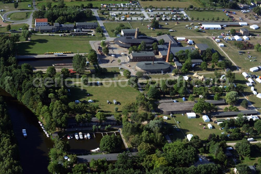 Aerial image Zehdenick - Mildenberg brick work park in the town area of Zehdenick in the state of Brandenburg. The park is an industrial memorial, surrounded by lakes and ponds. The compound consists of the company sites of two former brick works and is located in the North of the Mildenberg part of the town. View of the works, chimneys and factories of the compound