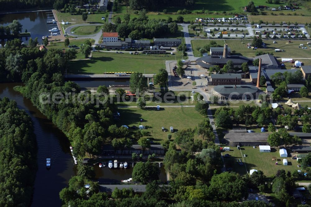 Aerial photograph Zehdenick - Mildenberg brick work park in the town area of Zehdenick in the state of Brandenburg. The park is an industrial memorial, surrounded by lakes and ponds. The compound consists of the company sites of two former brick works and is located in the North of the Mildenberg part of the town. View of the works, chimneys and factories of the compound