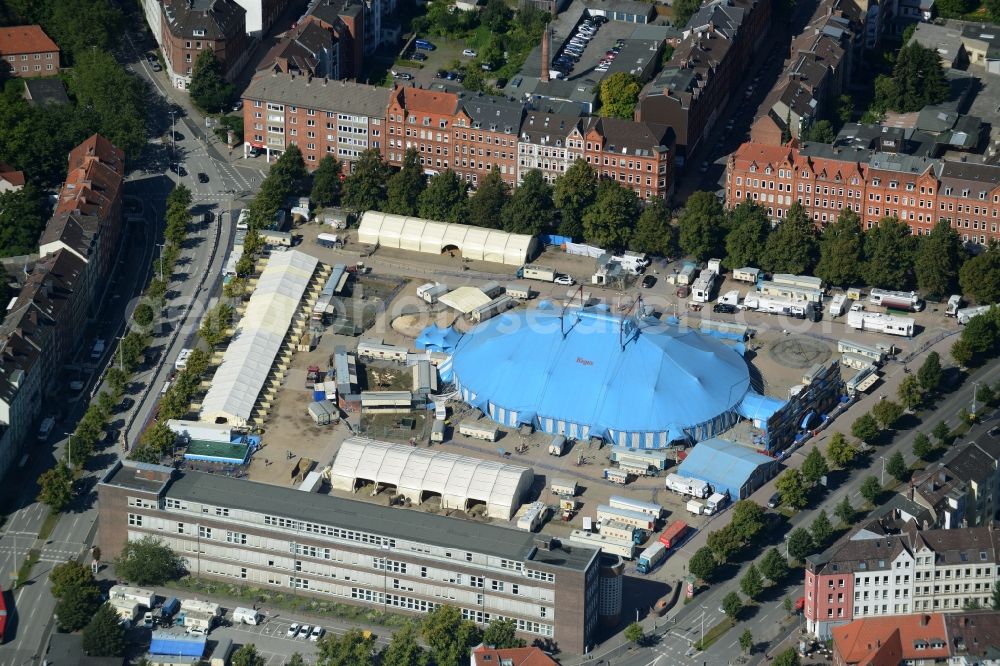 Kiel from the bird's eye view: Circus tent of Circus Krone on Wilhelmplatz in Kiel in the state of Schleswig-Holstein. The blue tent and the caravans are located on the square amidst residential buildings and streets