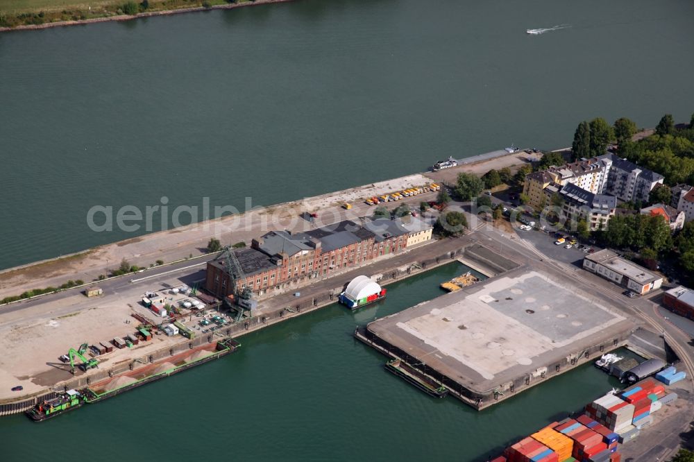 Mainz from the bird's eye view: Harbour in the Neustadt part of Mainz in the state of Rhineland-Palatinate. View of the industrial area in the North of the city. The custom harbour of Mainz on the Rhine is visible in the background. The compound consists of containers, cranes and docks