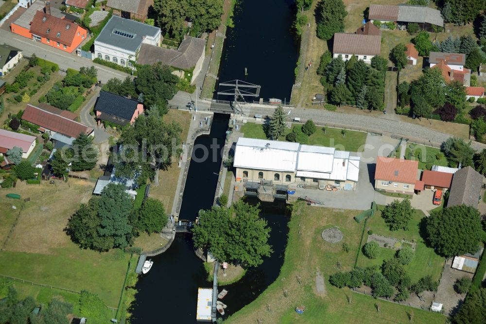 Aerial image Rietz-Neuendorf - Bridge, canal and watergate in the Neubrueck part of the borough of Rietz-Neuendorf in the state of Brandenburg. The facilities are located on the Northern shore of lake Wergensee