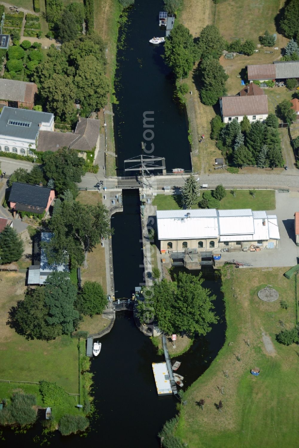 Aerial photograph Rietz-Neuendorf - Bridge, canal and watergate in the Neubrueck part of the borough of Rietz-Neuendorf in the state of Brandenburg. The facilities are located on the Northern shore of lake Wergensee
