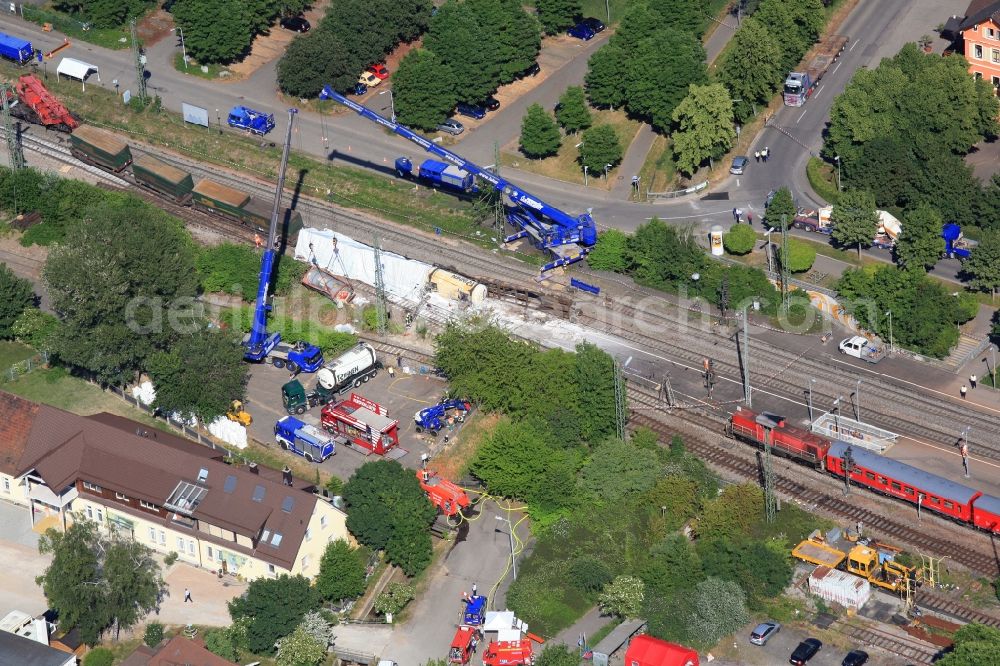 Müllheim from the bird's eye view: Salvage operations after train crash at the train station in Muellheim on the Upper Rhine in the Federal State of Baden-Wuerttemberg. At the railway accident freight wagons derailed, partially loaded with dangerous goods 