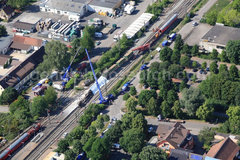 Müllheim from the bird's eye view: Salvage operations after train crash at the train station in Muellheim on the Upper Rhine in the Federal State of Baden-Wuerttemberg. At the railway accident freight wagons derailed, partially loaded with dangerous goods 