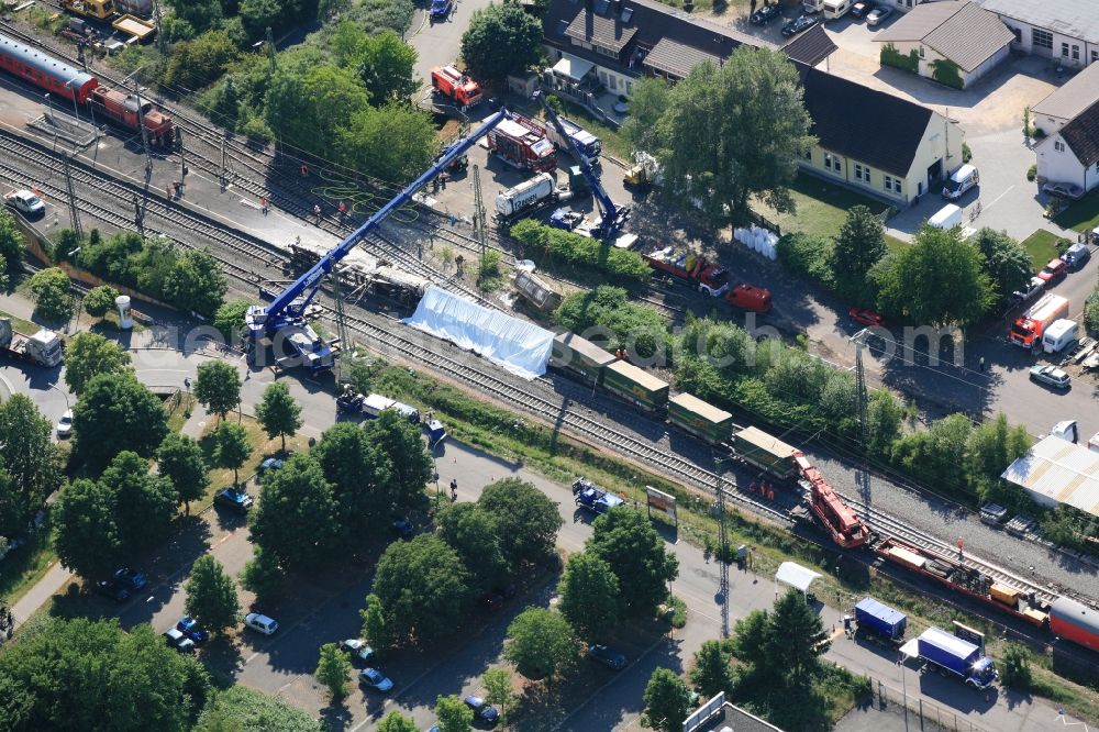 Aerial image Müllheim - Salvage operations after train crash at the train station in Muellheim on the Upper Rhine in the Federal State of Baden-Wuerttemberg. At the railway accident freight wagons derailed, partially loaded with dangerous goods 