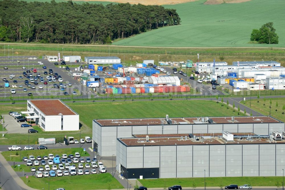 Schönefeld from the bird's eye view: Mostly untapped technical installations in buildings of making sure the infrastructure area of the airport BER in Schoenefeld in Brandenburg