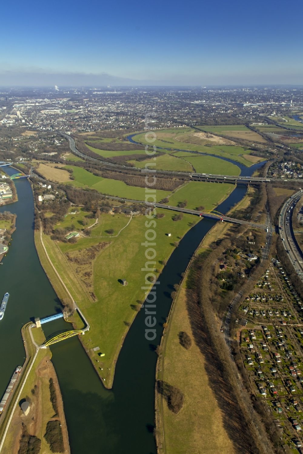 Aerial image Duisburg - The confluence of the Ruhr and Rhine-Herne Canal at Duisburg in North Rhine-Westphalia. The bridge is a landscape Ruhr lowlands of Industrial Heritage Trail so designated ensemble of bridges over the Ruhr on the outskirts of Duisburg