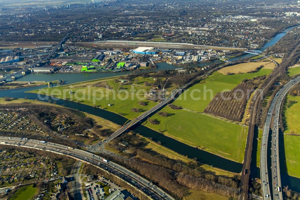 Duisburg from above - The confluence of the Ruhr and Rhine-Herne Canal at Duisburg in North Rhine-Westphalia. The bridge is a landscape Ruhr lowlands of Industrial Heritage Trail so designated ensemble of bridges over the Ruhr on the outskirts of Duisburg