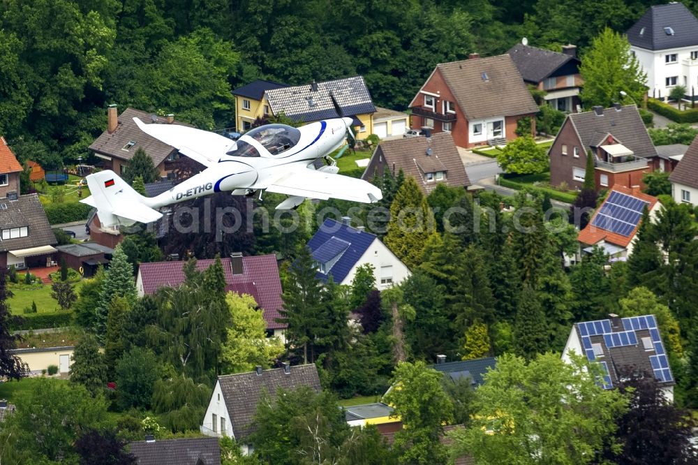 Hamm from the bird's eye view: Two-seat powered aircraft - sport aircraft Aquila A-210 AT01 on Hamm in North Rhine-Westphalia