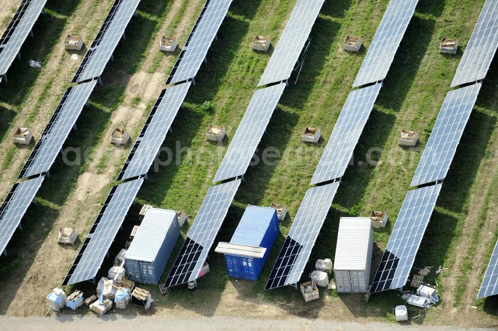 Tutow from the bird's eye view: Neuer zweiter Bauabschnitt des Solarenergiepark am Flugplatz Tutow in Mecklenburg - Vorpommern. Die juwi solar GmbH errichtet hier auf ca. 21 Hektar einen Solarpark mit ca. 65.500 Quadratmetern Solarmodulfläche bei ca. 91.000200 Einzelmodulen und einer Nennleistung von ca. 6780 Kilowattstunden jährlich. Modulhersteller ist die First Solar GmbH, die Unterkonstruktionen werden von der Fa. Schletter Leichtmetallbau GmbH errichtet. View of the second section of the solar energy park at the airport Tutow in Mecklenburg - Western Pomerania.