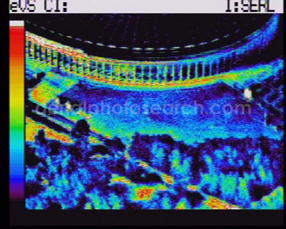 Infrared aerial photograph Berlin - Wärmeluftbild (Infrarotaufnahme) Blick auf das neue Olympiastadion in Berlin-Charlottenburg. Über 76.000 Zuschauer haben im neuen, umgebauten Stadion nun Platz und auch die technischen Gegebenheiten sind auf dem neuesten Stand. Das hervorragend ausgestattete Pressezentrum (Telex, Fotolabor, Bildfunk) und die exzellenten Voraussetzungen für Bild- und Tontechnik machen das Berliner Olympiastadion zu einer idealen Austragungsstätte für Sportveranstaltungen auf nationaler und internationaler Ebene. Auch für den Zuschauer hat das Stadion einiges zu bieten. Alle 76.000 Sitzplätze sind überdacht. 243 Scheinwerfer am Dach und 154 Scheinwerfer an den 88 Meter hohen Masten liefern über 1.500 Lux Lichtleistung. Damit ist jederzeit eine sehr gute Ausleuchtung des gesamten Spielfeldes gewährleistet. Olympiastadion Olympischer Platz 3 14053 Berlin